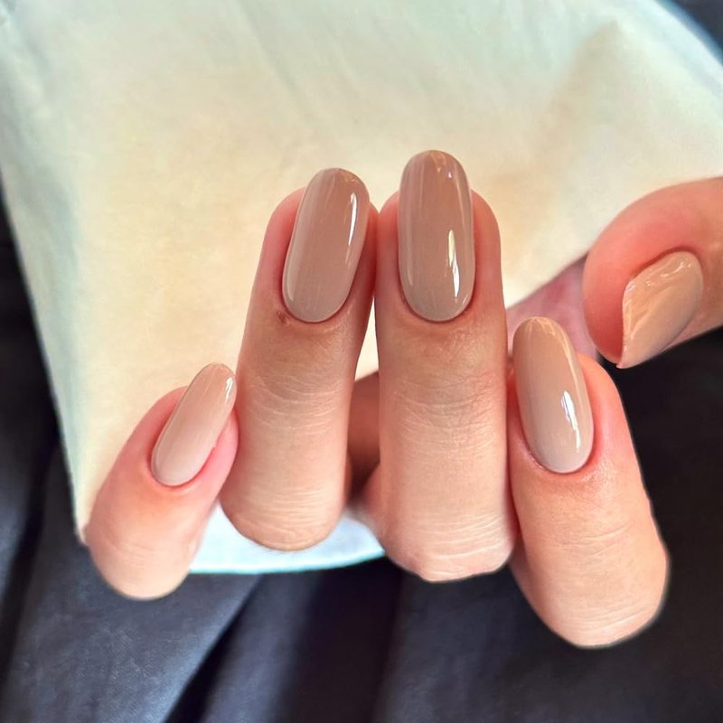 Nude Pink Press on Nails Short Almond Fake Nails with Nude Pink Solid Color Design Natural Glue on False Nail Solid Color Artificial Stick on Nail for Women 24Pcs