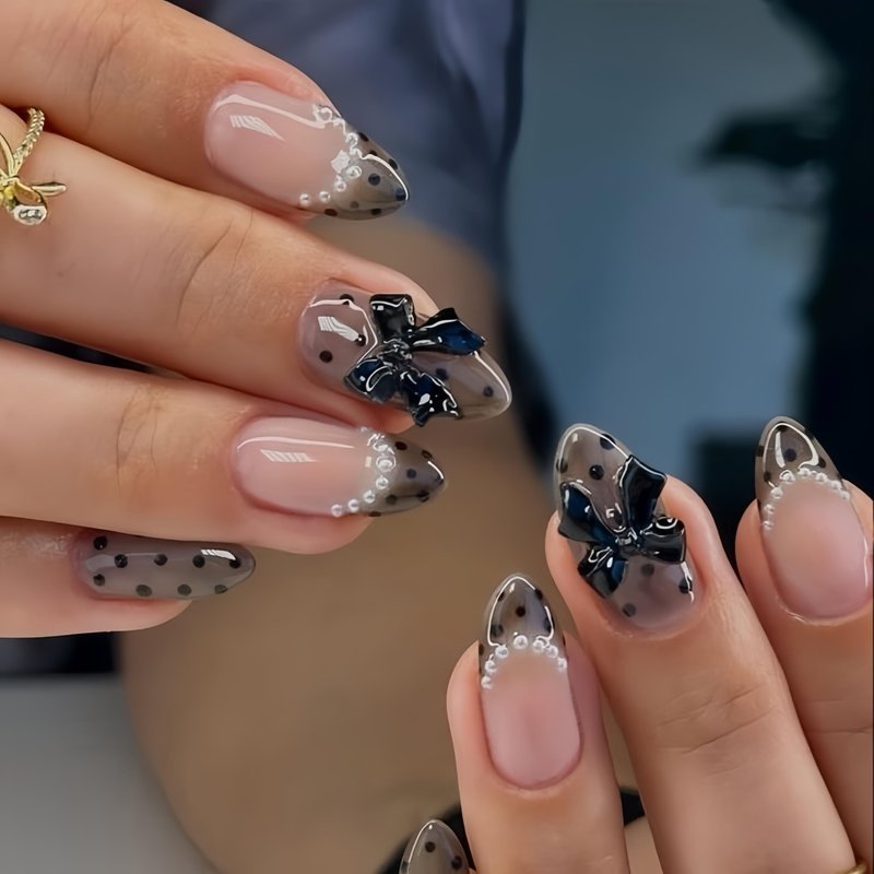 24 Pcs Black Polka Dot Press on Nails Medium Almond French Fake Nails with Bow Charms Designs Full Cover Acrylic Artificial Nails Glossy Glue on Nails Reusable Pearl French Stick on Nails for Women