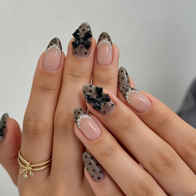 24 Pcs Black Polka Dot Press on Nails Medium Almond French Fake Nails with Bow Charms Designs Full Cover Acrylic Artificial Nails Glossy Glue on Nails Reusable Pearl French Stick on Nails for Women