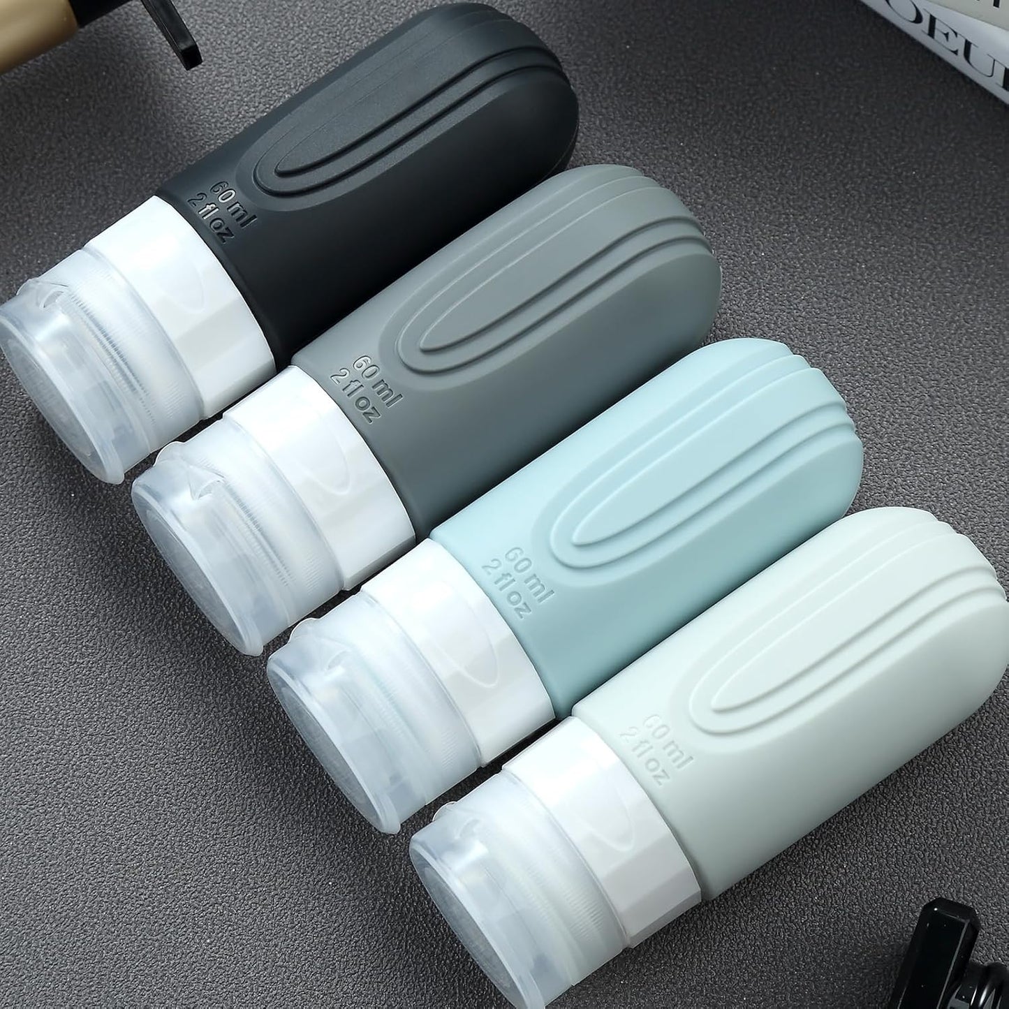 Travel Bottles for Toiletries - TSA Approved 2oz Leak Proof Containers | BPA Free with Toiletry Bag (4 Pack)