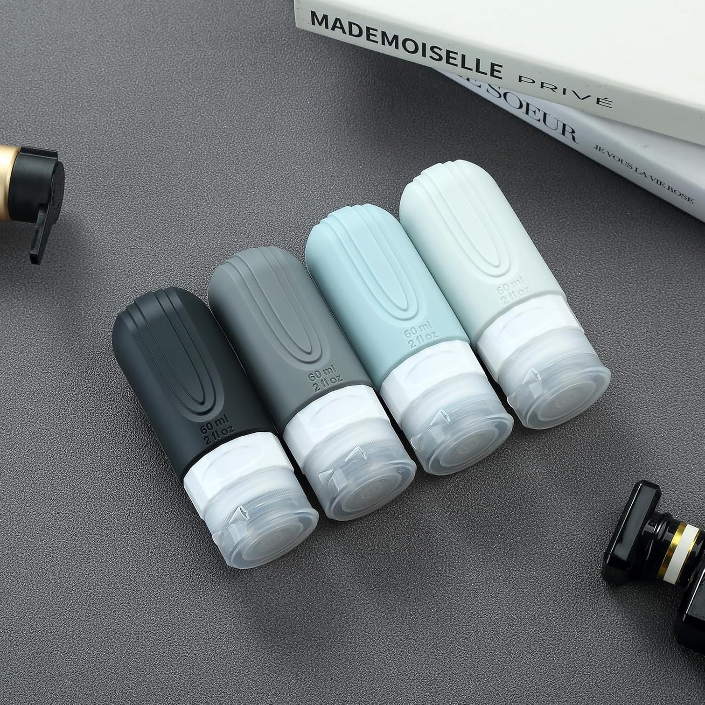 Travel Bottles for Toiletries - TSA Approved 2oz Leak Proof Containers | BPA Free with Toiletry Bag (4 Pack)